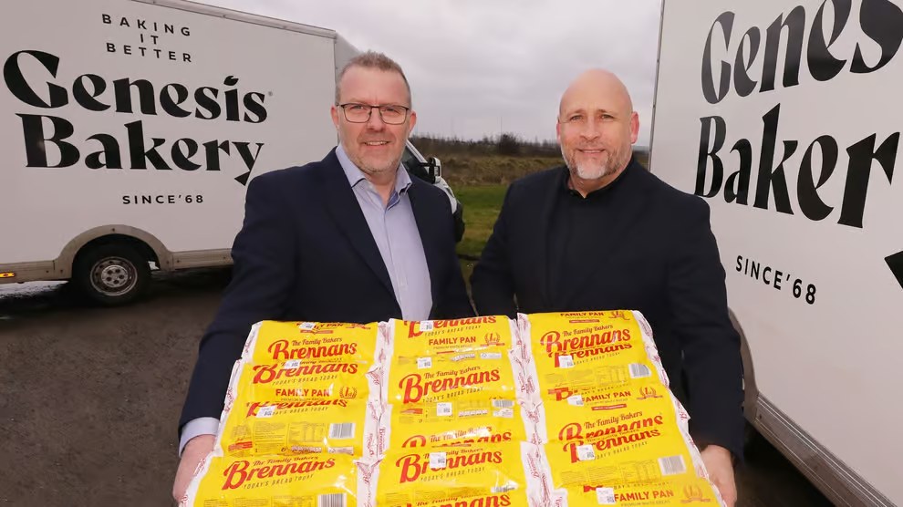 Two Genesis Bakery vans, with trays of Brennans bread being loaded for the routes
